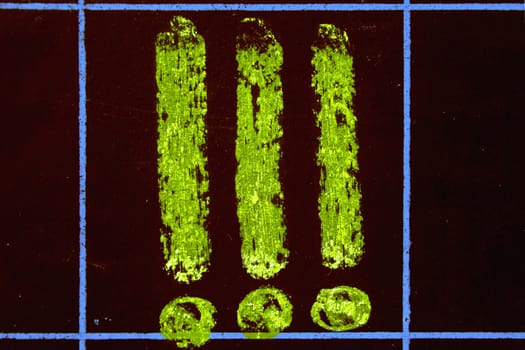 Three Exclamation Marks handwritten on black chalkboard