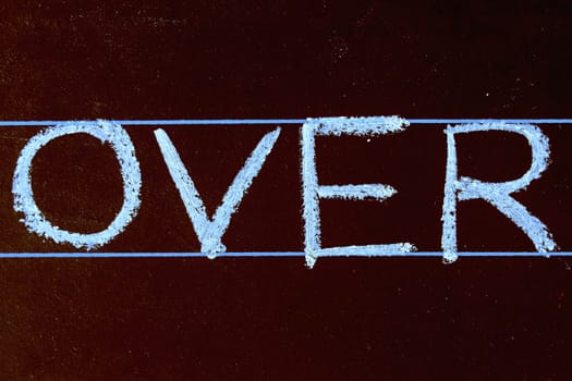 over word handwritten on black chalkboard