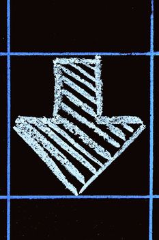 down side arrow sign handwritten on black chalkboard