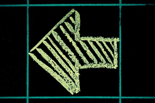 left side arrow sign handwritten on black chalkboard
