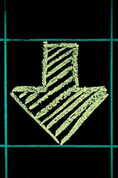 down side arrow sign handwritten on black chalkboard