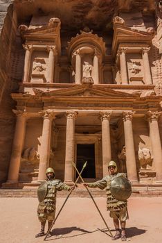 Petra, Jordan - May 11, 2013 Nabatean soldiers in front Al Khazneh or The Treasury in Nabatean Petra Jordan middle east