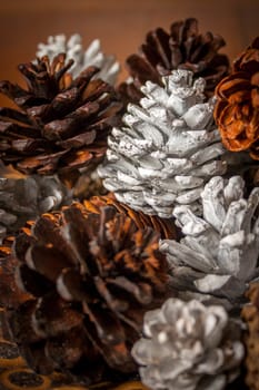 A close up of a group of painted pine cones.