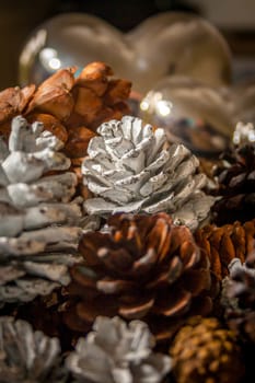 A close up of a group of painted pine cones.