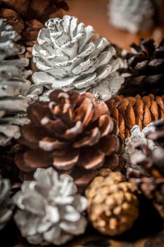 A close up of a group of painted pine cones.