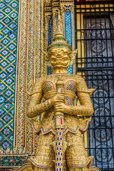 golden yaksha demon portrait at Phra Mondop grand palace Bangkok Thailand