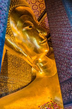 reclining buddha portrait at Wat Pho temple Bangkok Thailand