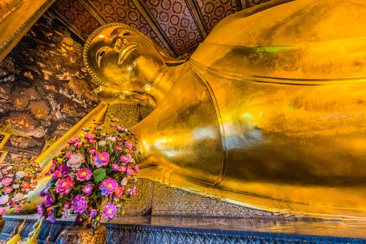 reclining buddha portrait at Wat Pho temple Bangkok Thailand