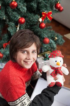10-12, beside, box, boy, camera, caucasian, celebration, child, childhood, christmas, christmastime, claus, cute, event, eyes, floor, gift, giftbox, green, handsome, happiness, holiday, kid, look, looking, merry, model, new, occasion, old, people, person, present, property, releases, santa, sitting, smile, smiling, son, surprise, tree, x-mas, xmas, year, years, youngster, toy, teddy, , hold, holding
