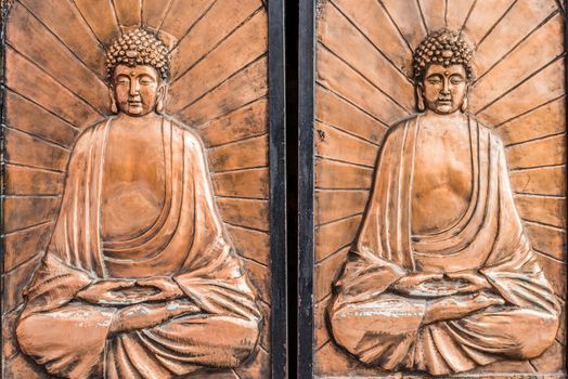 doors with buddha carving at Soho Central in Hong Kong