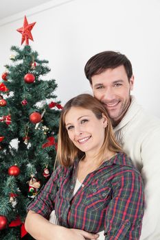 30-35, adult, background, ball, caucasian, celebrate, celebration, christmas, couple, cute, day, december, decorate, decorating, decoration, decorations, emotion, family, female, fun, gift, girl, green, happiness, happy, holiday, home, house, hug, husband, love, portrait,  lovers, male, man, marriage, men, model, new, old, person, present, property, red, relationship, releases, ribbon, romantic, santa, smile, star, together, tree, vertical, white, wife, winter, woman, women, xmas, year, years, young