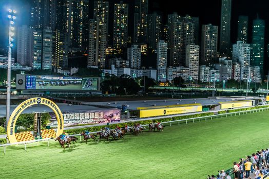 Happy Valley, Hong Kong, China- June 5, 2014: horse race at Happy Valley racecourse