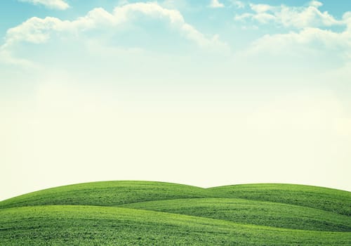 Green hills under bright sky. Nature concept