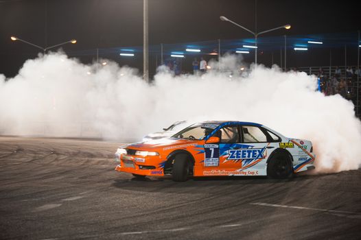 PATTAYA - NOVEMBER 29: Nattapon Rachawat competing during Thailand Drift Series 2014 at Chayapruek, in Pattaya, Thailand on November 29, 2014.