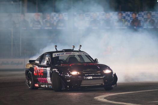 PATTAYA - NOVEMBER 29: Nonchai Jianwanon competing during Thailand Drift Series 2014 at Chayapruek, in Pattaya, Thailand on November 29, 2014.