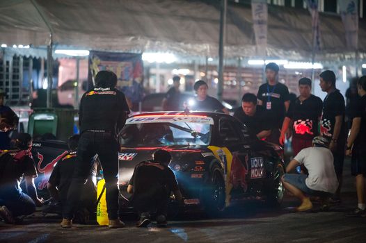 PATTAYA - NOVEMBER 30: Kiki Sak Nana's car being prepared for the race during Thailand Drift Series 2014 at Chayapruek, in Pattaya, Thailand on November 30, 2014.