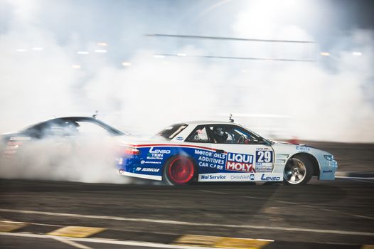 PATTAYA - NOVEMBER 30: Kunchadi Ruwattana competing during Thailand Drift Series 2014 at Chayapruek, in Pattaya, Thailand on November 30, 2014.