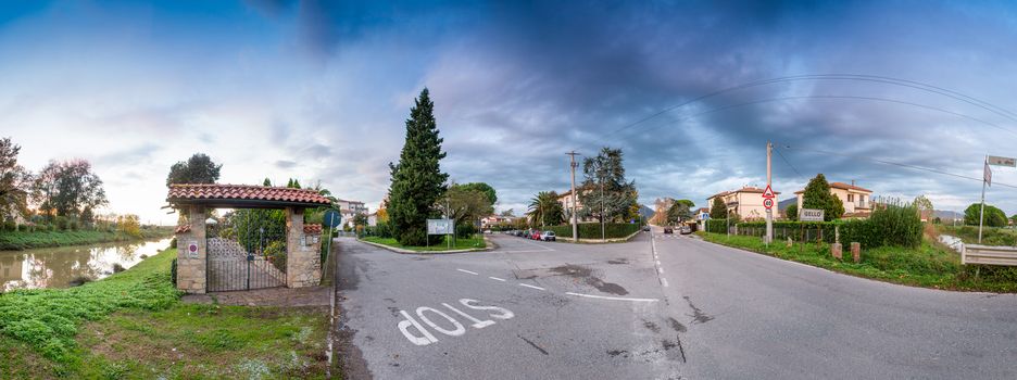 Beautiful countryside wet road intersection at dusk.