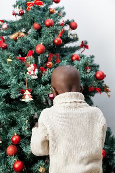 4-6, african, apartment, back, ball, balls, black, boy, celebration, child, christmas, cute, decoration, family, festive, happy, home, homey, house, joyful, kid, life, lifestyle, little, living, love, male, model, old, one, person, portrait, pretty, property, relationship, releases, room, time, tree, vertical, years, young