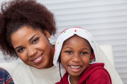 30-35, 4-6, african, apartment, background, beautiful, black, celebration, cheerful, child, christmas, cute, dad, family, father, gift, hair, happiness, happy, hat, home, homey, horizontal, house, kid, leisure, life, living, model, old, parent, person, portrait, pretty, property, red, releases, room, sitting, smile, smiling, son, together, two, xmas, years, young