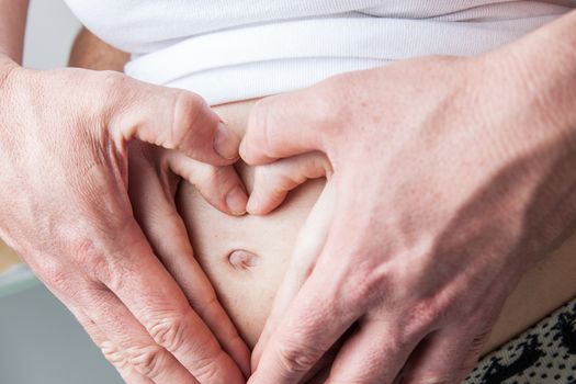 35-40, abdomen, adult, baby, belly, care, caucasian, couple, cute, detail, expectant, expecting, family, female, hand, hands, happy, health, healthy, heart, holding, horizontal, human, life, love, male, man, maternal, maternity, model, mom, mother, motherhood, old, parent, parenthood, person, pregnancy, pregnant, property, release, shape, symbol, two, waiting, white, woman, years