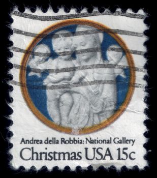 Virgin Mary with baby Jesus and angels. Andrea Della Robbia's sculpture, National Gallery. Christmas postage stamp, uploaded in 2014