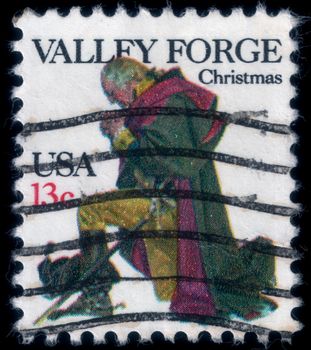 A gentlemen prays in Valley Forge. Christmas postage stamp, uploaded in 2014