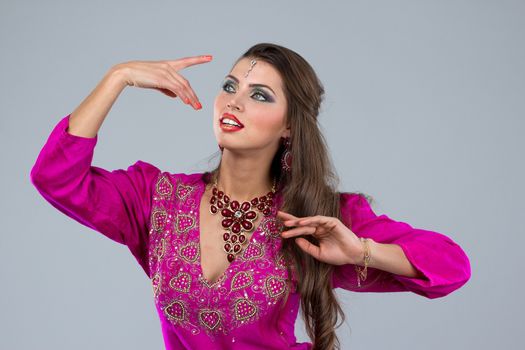Pretty European woman posing in Indian Style