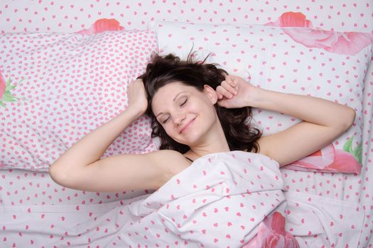 Young beautiful girl woke up alone in bed