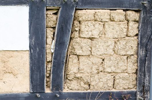 Medieval house wall plastered with clay, in the bar