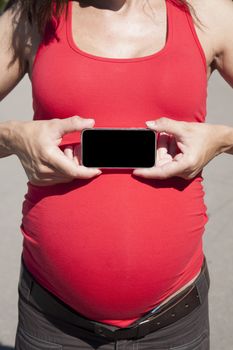 pregnant woman showing horizontal blank screen smartphone