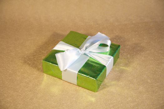 gift box with ribbon and bow at still life