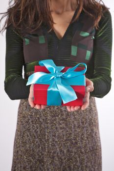 woman detail with a gift box in her hands