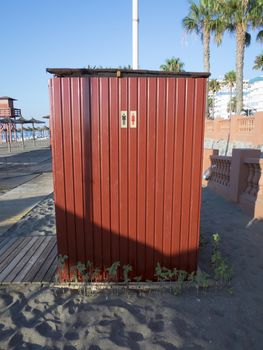 man and woman wc icon on red pattern metal wall in beach of Benalmadena Andalucia Spain
