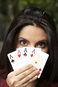 pretty woman with four aces in her hand
