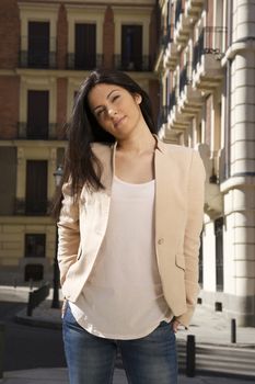 pretty brunette woman standing at street in Madrid city Spain
