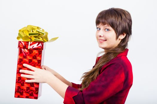 Young beautiful girl with a gift box