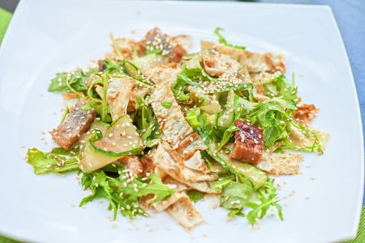 Salad with smoked eel. Japanese food