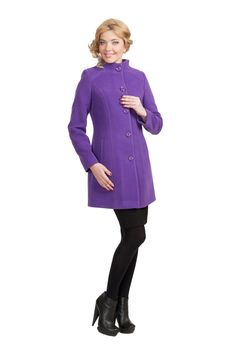 The girl in a violet autumn coat on a white background