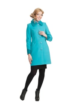 The girl in a turquoise autumn coat on a white background