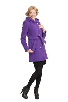 The girl in a violet autumn coat on a white background