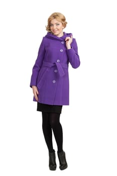 The girl in a violet autumn coat on a white background