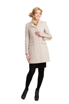 The girl in a white autumn coat on a white background