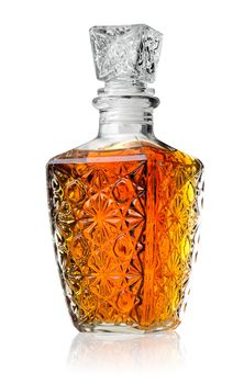 Crystal decanter with cognac isolated on white