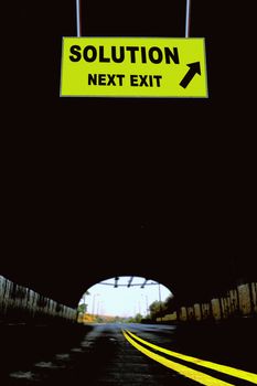 A Notice Board On A National Highway tunnel  Showing Solution Next Exit Concept
