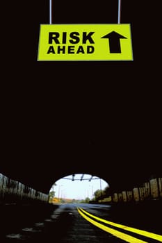 A Notice Board On A National Highway tunnel  Showing Risk ahead Concept
