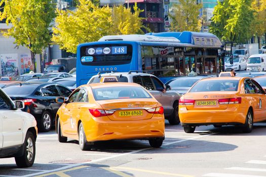 Seoul, Republic of Korea - November 4, 2014: Traffic approaching on a busy road through the Gangnam district on November 4, 2014 in seoul, Gangnam is an affluent district in Seoul, South Korea.