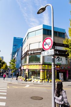 Seoul, South Korea -November 4, 2014: Shinsa-dong Garosugil Street on November 4, 2014 in Seoul, South Korea. This district contains many department stores, hairshops, churches, boutiques, cafes and restaurants.