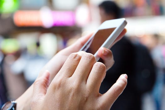 Teenage girl text messaging on her phone