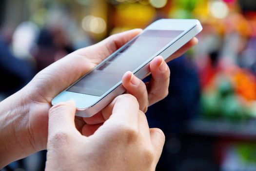 Teenage girl text messaging on her phone